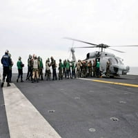 Tengerészek és tengerészgyalogosok rakomány kellékek rá egy HH-60H Seahawk Poszter Nyomtatás Stocktrek Images